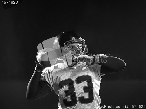 Image of american football player throwing rugby ball