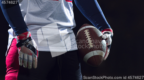 Image of portrait of confident American football player