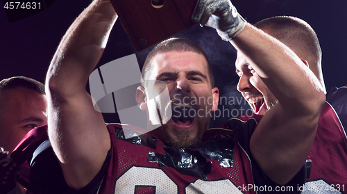 Image of american football team celebrating victory