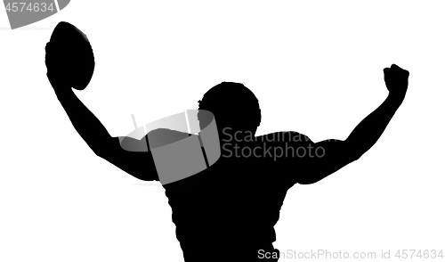 Image of american football player celebrating after scoring a touchdown