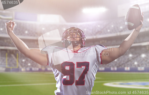 Image of american football player celebrating after scoring a touchdown