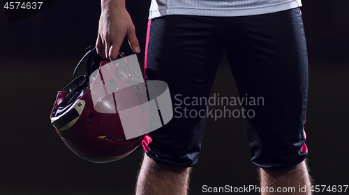 Image of portrait of young confident American football player