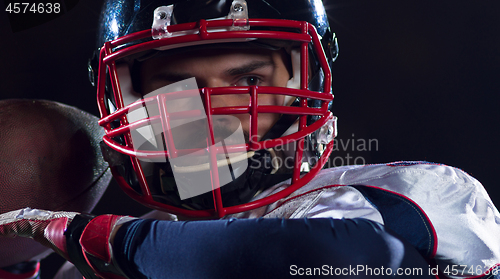 Image of american football player throwing rugby ball