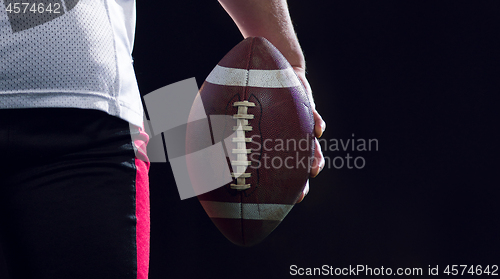 Image of rear view of young confident American football player