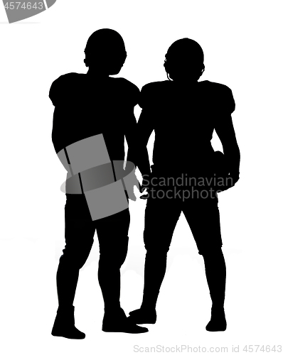 Image of Two American football players standing  on the field