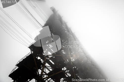 Image of Large radar antenna in the fog