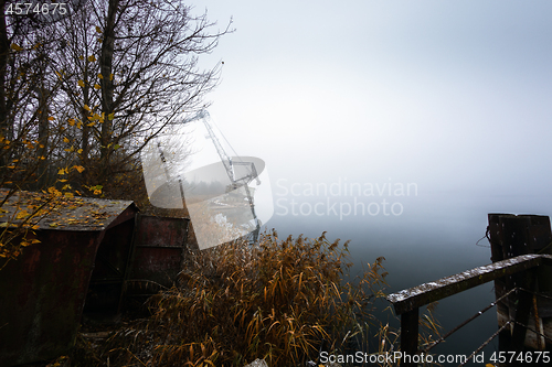 Image of Rusty old industrial dock cranes at the abandoned dock