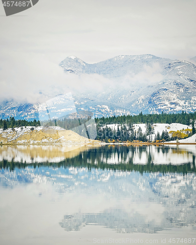 Image of Snowy Fall Reflection on Mountain Lake