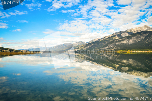 Image of Cloud and Blue Sky Reflection in Mountain Lake Landscape