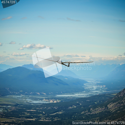 Image of Duodiscus Glider Flying around Mountains