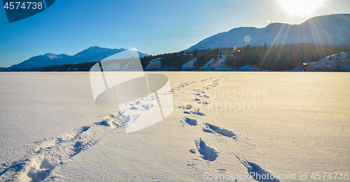 Image of Foot prints in the snow, winter mountain landscape