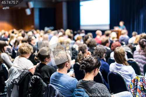 Image of Speaker giving presentation on scientific business conference.