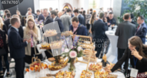 Image of Abstract blured photo of business people socializing during banquet lunch break break at business meetin, conference or event