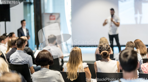 Image of Male business speaker giving a talk at business conference event.