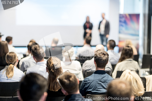 Image of Male business speaker giving a talk at business conference event.