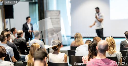 Image of Male business speaker giving a talk at business conference event.