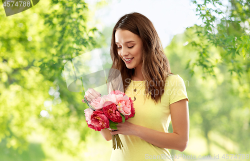 Image of young woman or teenage girl with flower bouquet