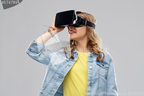 Image of teen girl in virtual reality headset or vr glasses