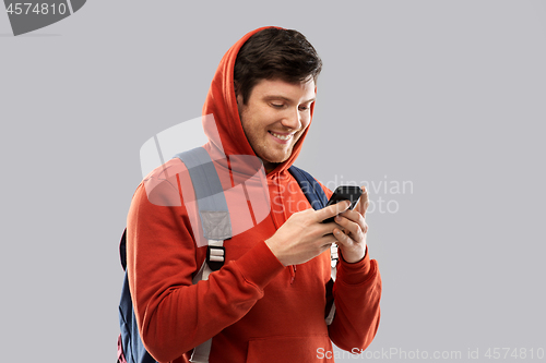 Image of man or student with smartphone and school bag