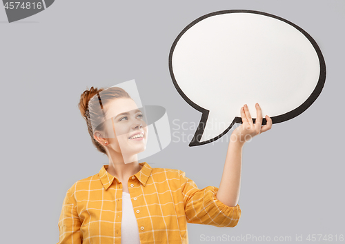 Image of red haired teenage girl holding speech bubble