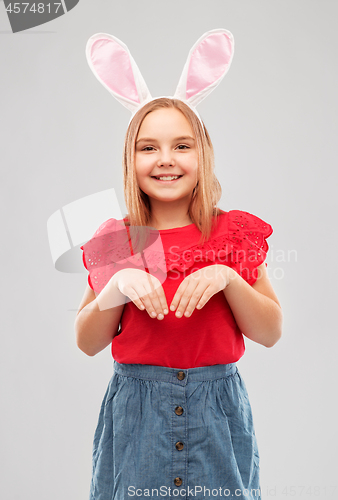 Image of happy girl wearing easter bunny ears headband