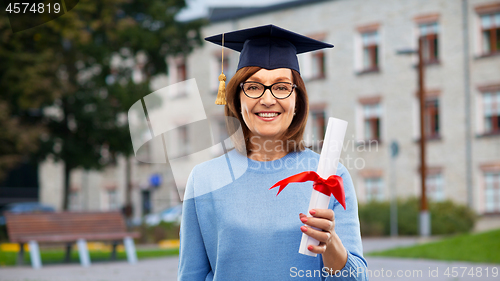 Image of happy senior graduate student woman with diploma