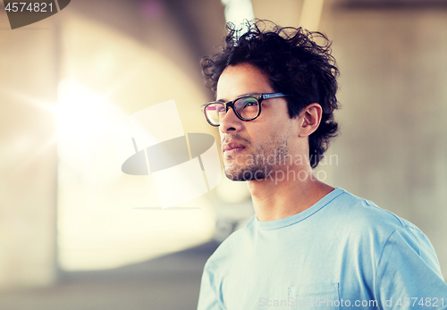 Image of man in eyeglasses on city street