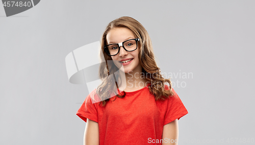 Image of smiling student girl in glasses and red t-shirt