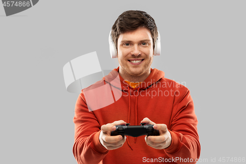 Image of man with gamepad playing video game