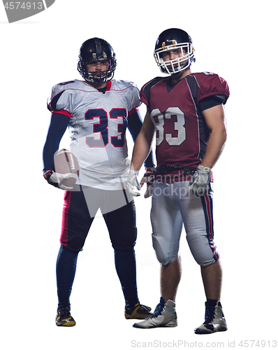 Image of Two American football players standing  on the field