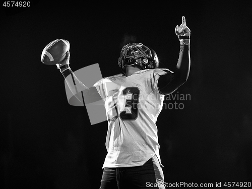 Image of american football player celebrating after scoring a touchdown