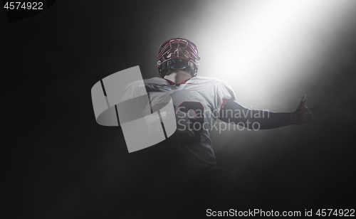 Image of american football player celebrating after scoring a touchdown