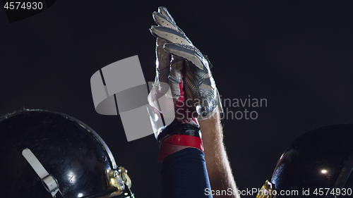 Image of american football players celebrating after scoring a touchdown