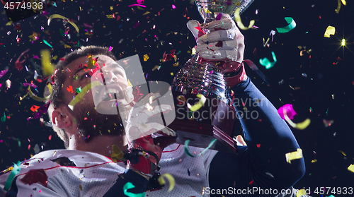 Image of american football team celebrating victory