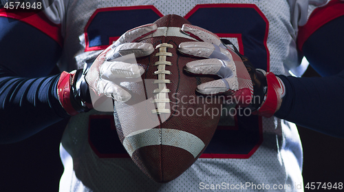 Image of portrait of confident American football player