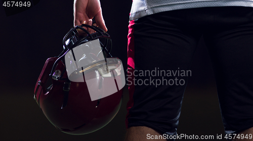 Image of rear view of young confident American football player