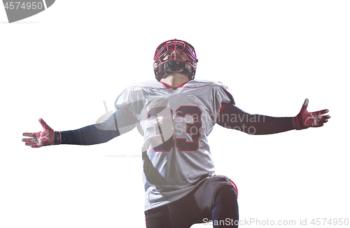 Image of american football player celebrating after scoring a touchdown