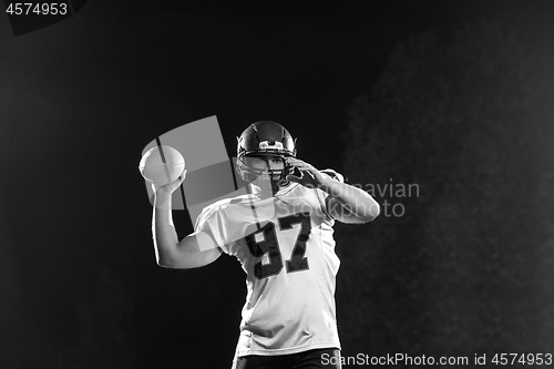 Image of american football player throwing rugby ball