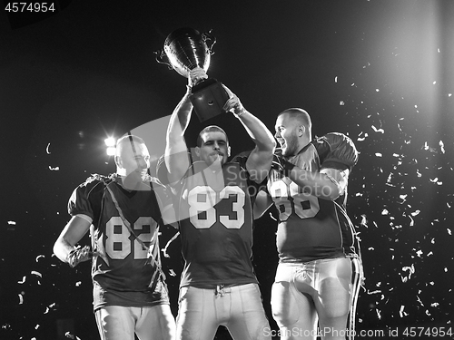 Image of american football team celebrating victory