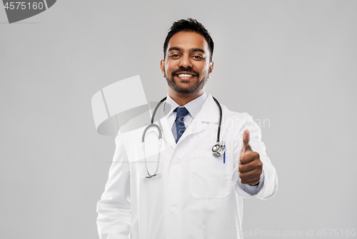 Image of smiling indian male doctor showing thumbs up