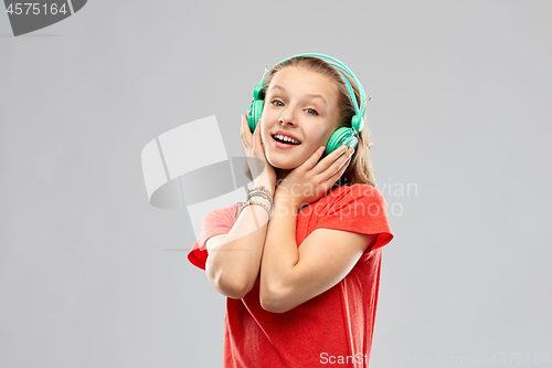 Image of happy teenage girl with headphones