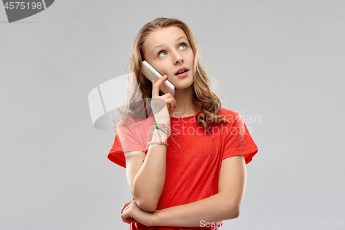 Image of bored teenage girl calling on smartphone