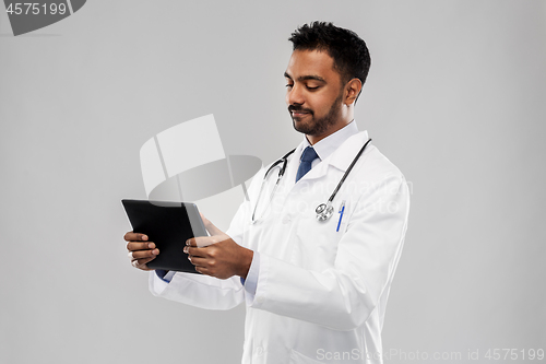 Image of indian male doctor with tablet computer