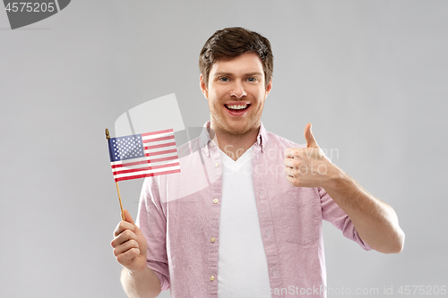 Image of happy man with american flag showing thumbs up