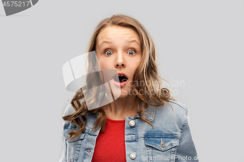 Image of surprised or shocked teenage girl in red t-shirt