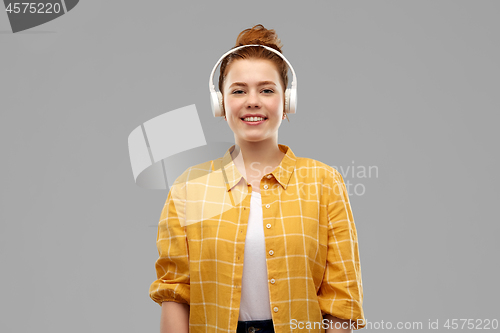 Image of teenage girl in headphones listening to music