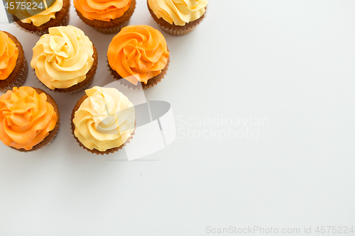 Image of cupcakes with frosting on white background