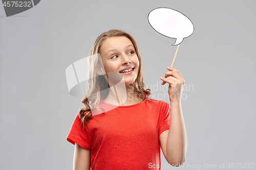 Image of smiling teenage girl holding blank speech bubble