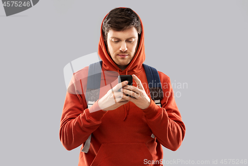 Image of man or student with smartphone and school bag