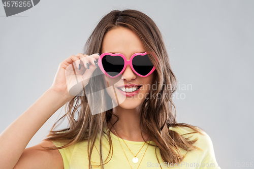 Image of teenage girl in heart-shaped sunglasses